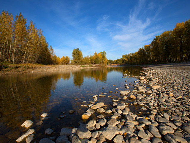 Sheep River running through park in Okotoks